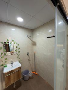 a bathroom with a sink and a shower at The Orion Nest in Noida +22 photos