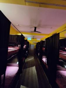 an empty train car with beds and a ceiling at Shri Ashray in Varanasi +3 photos