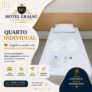 a sign for a bed with a bow tie on it at Hotel Grajaú in Arcos