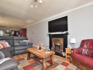 a living room with a couch and a fire place at 2 Bed in Morpeth oc-36925 in Widdrington