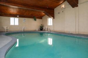 a large swimming pool in a hotel room at Super 8 by Wyndham Gallup in Gallup
