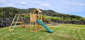 a playground with a slide and a climbing frame at Adega do Bisavô in Santa Cruz da Graciosa
