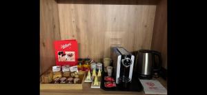 a counter with a coffee maker and other items on it at Chambre d'Hotes Vista Monte Bianco in La Salle