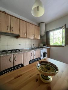 a kitchen with a table and a bowl on top of it at Orgiva - La Alpujarra in Órgiva