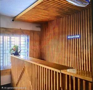 an office with a reception desk with a sign on the wall at S K Comforts in Bangalore