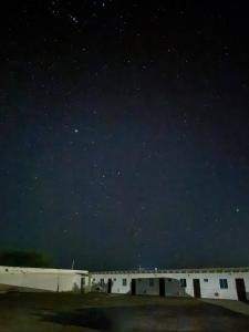 a starry night with a group of buildings in a field at Hotel Cabo Royal in Cabo de la Vela +4 photos