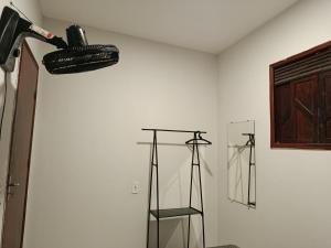 a room with two black objects on the wall at Casa de clecia in Natal