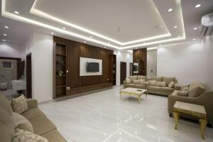 a large living room with couches and a table at فيلا ابو بندر in Jeddah