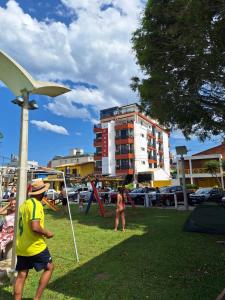 a group of people playing in a park at Hotel Vila Mar in Florianópolis +120 photos
