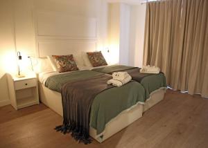 a bedroom with a bed with two towels on it at Casa Rural Garcés in Lumbier