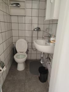 a bathroom with a toilet and a sink at Manolia !!! in Kranidi