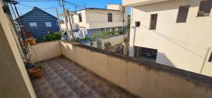 an apartment balcony with a view of a building at Villa Doda in Durrës