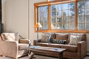 a living room with a couch and a coffee table at Sugarbush Seclusion in Vermont in Waitsfield
