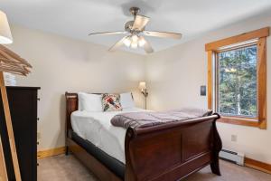a bedroom with a bed and a ceiling fan at Sugarbush Seclusion in Vermont in Waitsfield