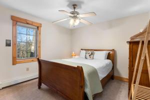 a bedroom with a bed and a ceiling fan at Sugarbush Seclusion in Vermont in Waitsfield