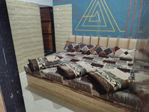 a bedroom with a bed with pillows on it at Hotel Murlidhar in Chikāra