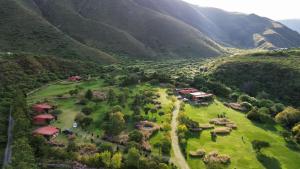 an aerial view of a farm in a mountain at El Caserío Jujuy in Volcán