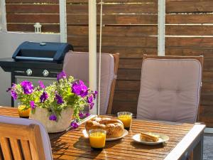 a table with some food and flowers on it at Averto House Lefkada in Lefkada +64 photos