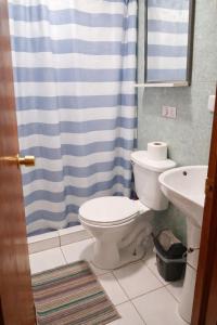 a bathroom with a toilet and a sink at Noface 2 in El Cerrillo