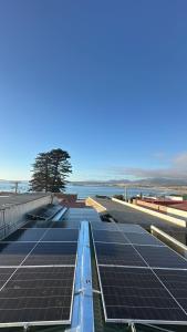 a group of solar panels on the roof of a building at Noface 2 in El Cerrillo
