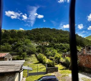 a view from the window of a house at Sekretet e Luginës Restaurant - Hostel - Camping in Vau i Dejës +11 photos