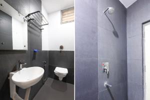 a bathroom with a toilet and a sink and a shower at Super Townhouse V Hotel in Gunadala
