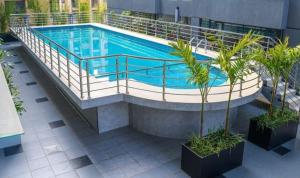 a swimming pool in a building with a swimming poolvisor at Neptune Luxe in Nairobi