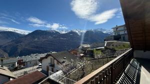 a view from a balcony of a town with mountains at Appartamento Belvedere in Teglio