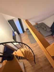 an overhead view of a living room and a loft at GalerieLoft Winterzeit Thunersee&Mountainview in Thun