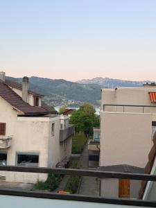 a view from the balcony of a building at GalerieLoft Winterzeit Thunersee&Mountainview in Thun