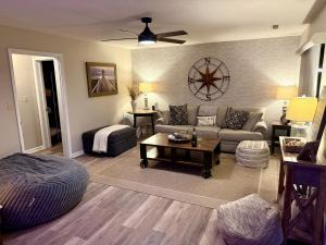 a living room with a couch and a table at High Rock Haven in Lexington