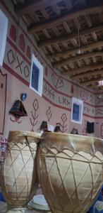 a room with a wall with writing on it at Riad DAR outebba in Zaouïet Sidi Daoud