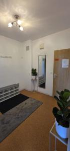 an empty room with a potted plant and a door at Auszeit im Grünen in Vohenstrauß