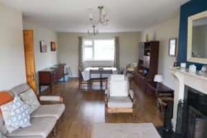 a living room with a couch and a table at Avalon in Bundoran