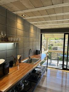 a kitchen with a sink and a counter top at Pedre Loft in La Pedrera