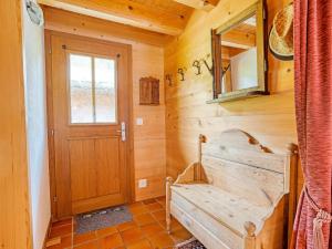 a wooden hallway with a door and a bench at Alpenchalet mit Charme in Lenk +31 photos
