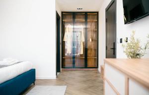 a bedroom with a door leading to a closet at Boutique Hotel Zara in Ulcinj
