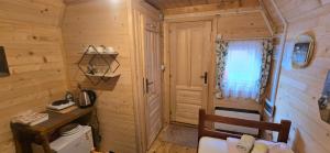 a small room with a desk and a window at Bungalows Prokletije in Gusinje