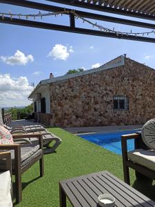 a view from the patio of a villa with a pool at Casa Rural MONTE VERDE in Illana