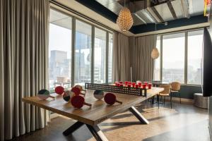 a dining room with a table with a chess board at Moxy Portland Downtown in Portland