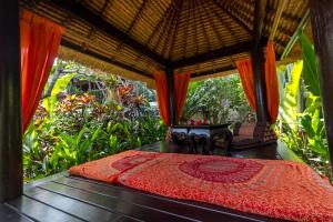 Photo de la galerie de l'établissement Tropical Bali Hotel, à anur