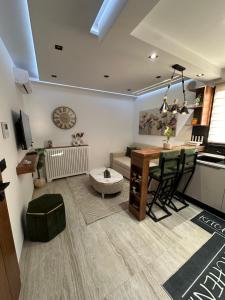 a living room with a table and a couch at Apartment in Sousse in Sousse +5 photos
