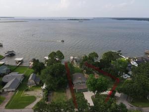 an aerial view of a lake with houses and a boat at Lakeview Lookout in Tool