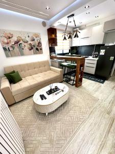a living room with a couch and a table at Apartment in Sousse in Sousse