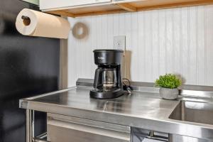 a coffee maker sitting on top of a kitchen counter at Fisher Flats Downstairs in Cedar Key +11 photos