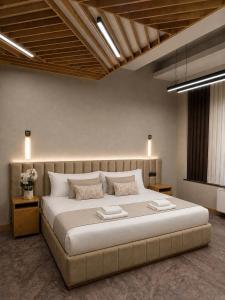 a bedroom with a large bed in a room at Yerevan Resident Hotel in Yerevan