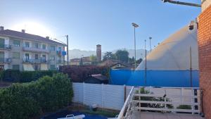 a white fence and a building and a tent at B&B Gatto Rosso in Sandigliano +27 photos