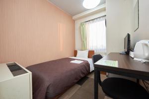 Кровать или кровати в номере Hotel Select Inn Utsunomiya