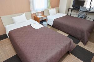 Postel nebo postele na pokoji v ubytování Hotel Select Inn Utsunomiya