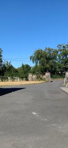 an empty parking lot with trees in the background at Stickens Apartment in Naas